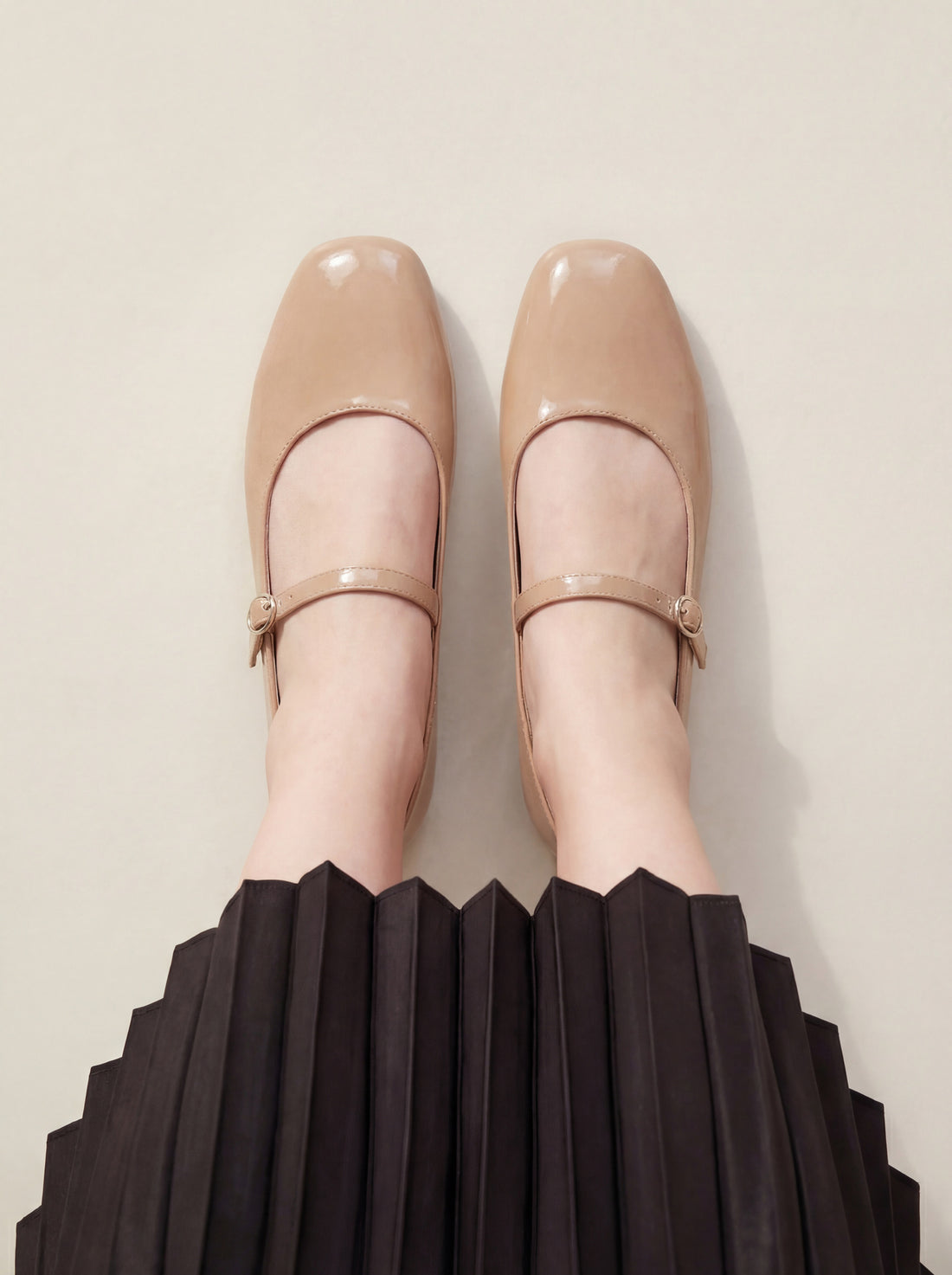 Woman wearing beige Mary Jane flat shoes with buckle strap – Laal Mahal Pakistan