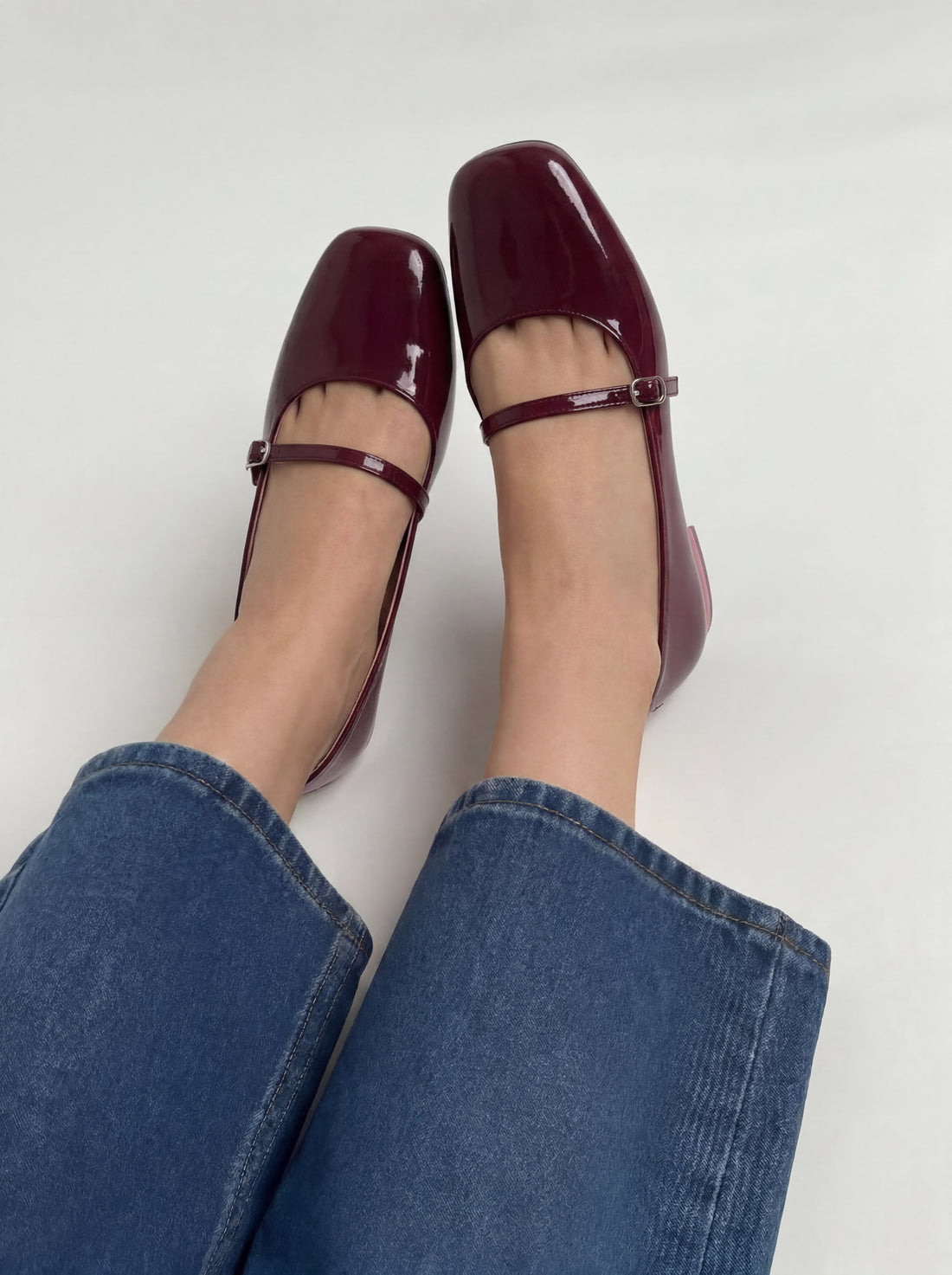 Bella burgundy patent leather mary jane flat shoes worn on feet street style Pakistan — Laal Mahal