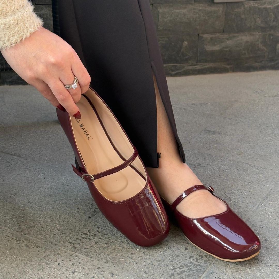 Bella burgundy patent leather mary jane flat shoes worn on feet street style Pakistan — Laal Mahal