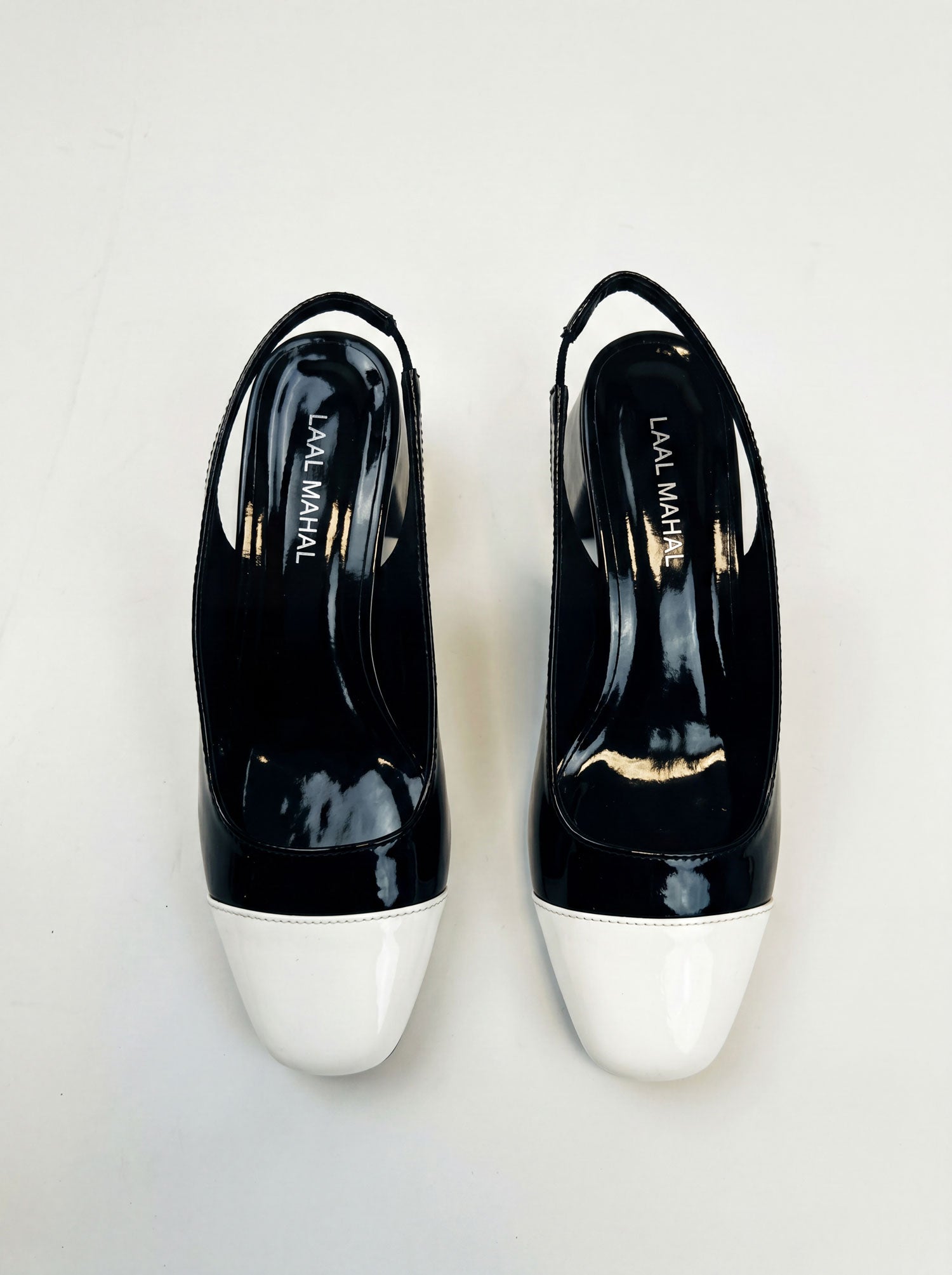 Black and white slingback block heels flat lay white background Pakistan — Laal Mahal
