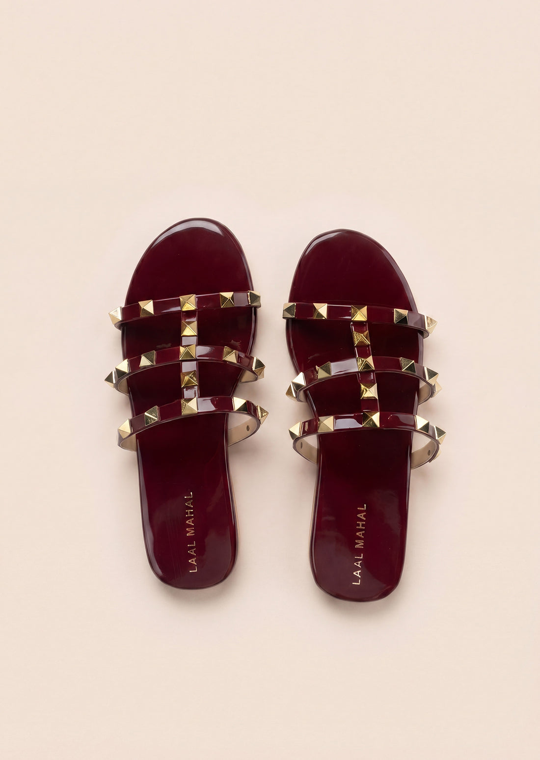 Burgundy rockstud flat slides flat lay white background Pakistan — Laal Mahal