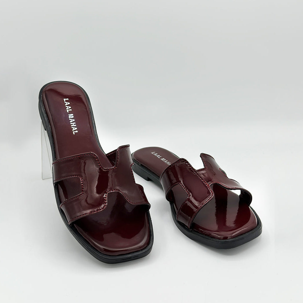 Cherry Chic burgundy patent leather flat slides pair side view studio white background Pakistan — Laal Mahal