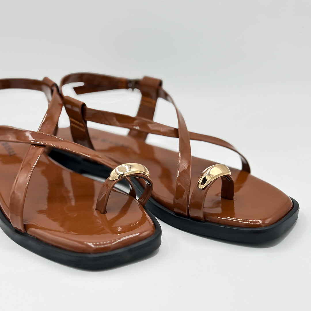 Cocoa Vibe tan patent cross strap flat sandals gold detail close-up women Pakistan – Laal Mahal