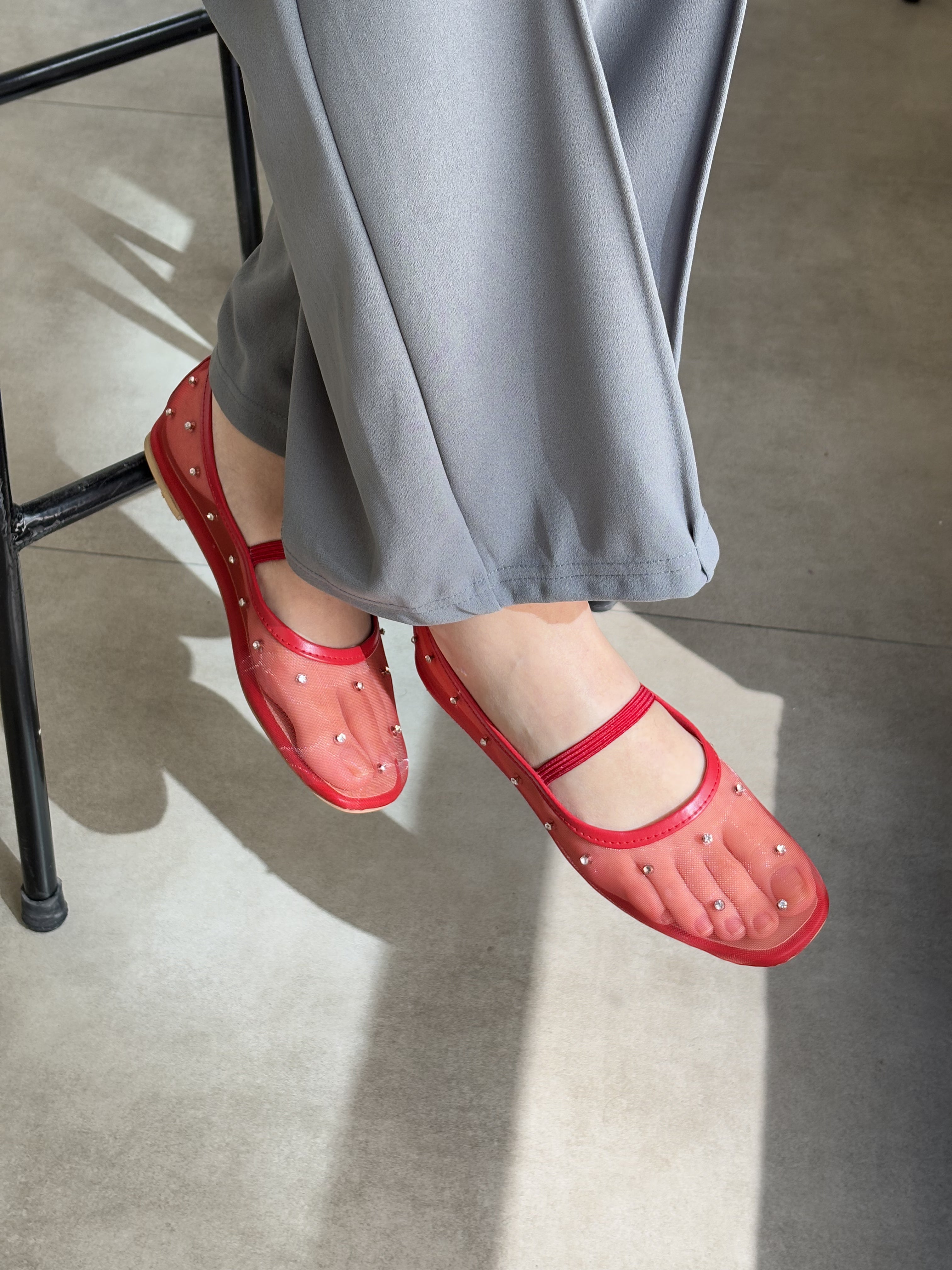 Crystal Gaze red rhinestone ballet flat shoes worn close up feet Pakistan — Laal Mahal