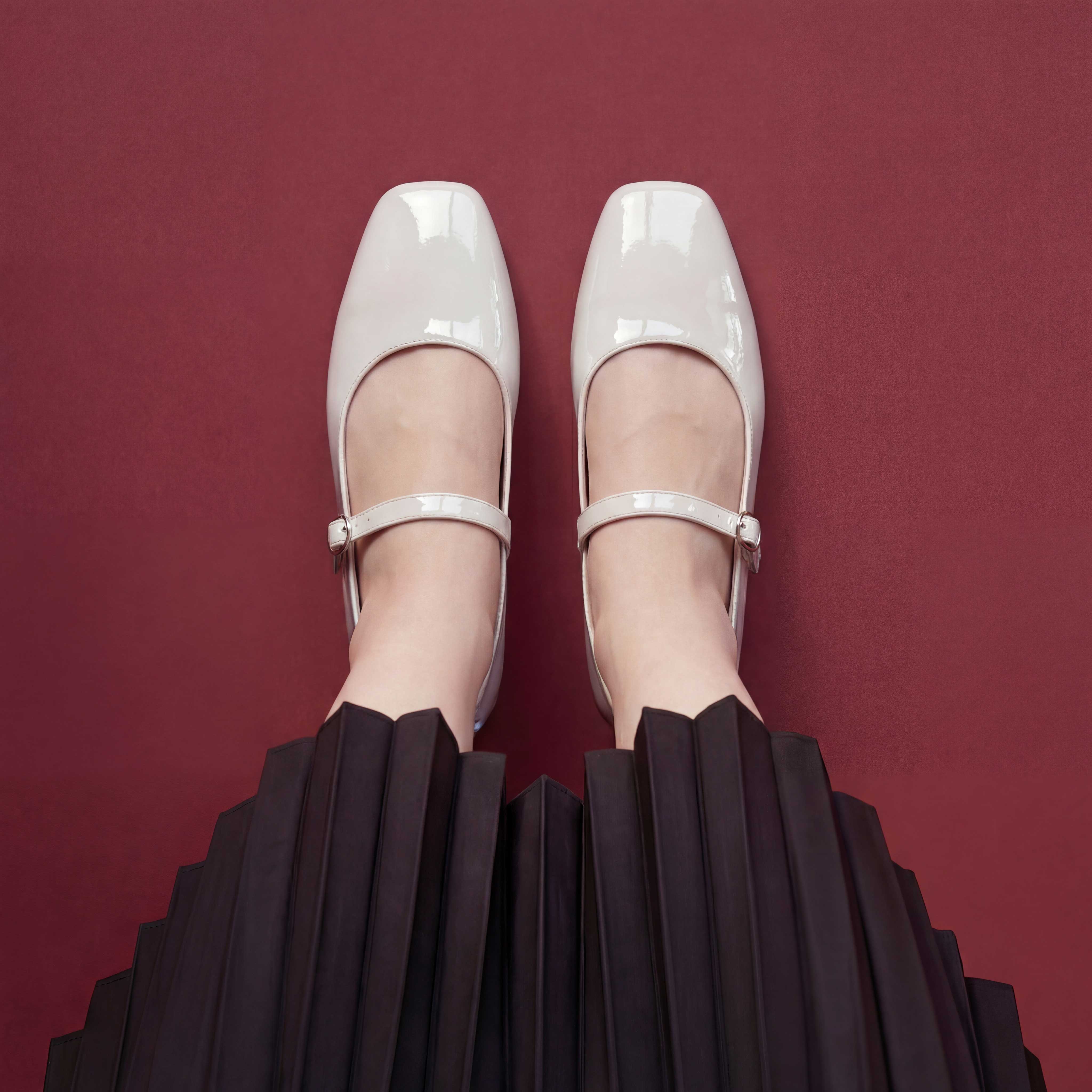 Dove Walk white patent leather mary jane flat shoes worn with black skirt Pakistan — Laal Mahal