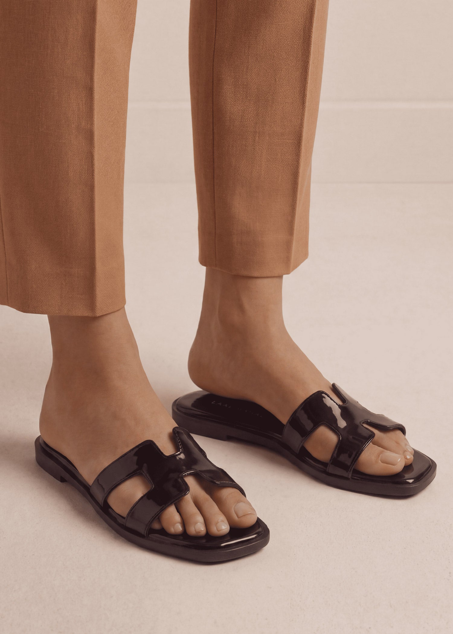 Glossy Black patent H-strap slide flat sandals on feet front view women Pakistan – Laal Mahal