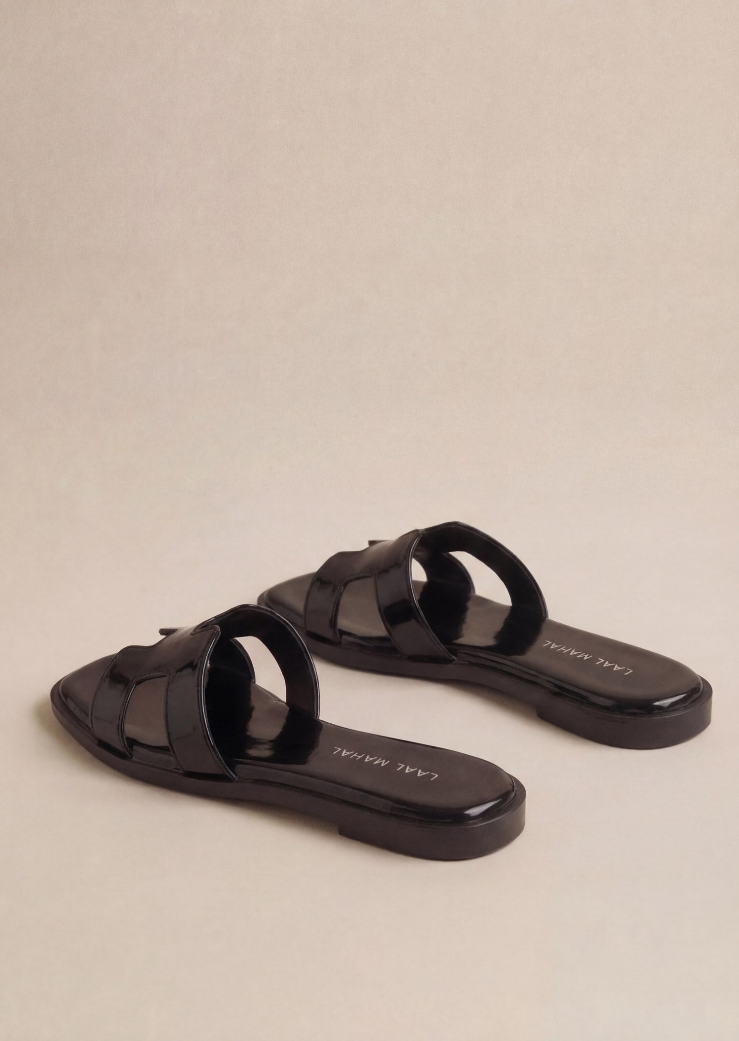 Glossy Black patent H-strap slide flat sandals pair angled view women Pakistan – Laal Mahal
