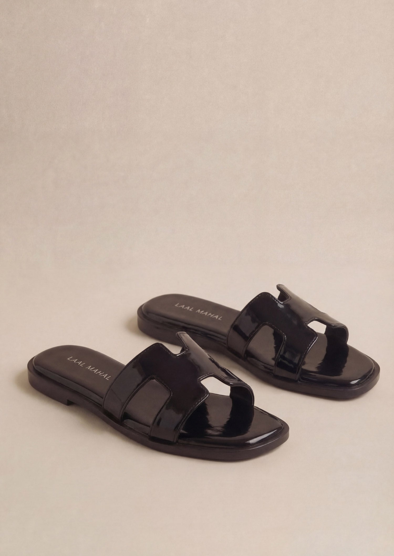 Glossy Black patent H-strap slide flat sandals pair on white background women Pakistan – Laal Mahal
