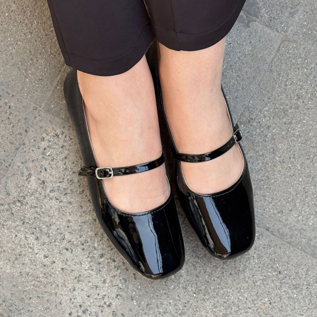Glossy Black patent leather mary jane flats close up worn on feet Pakistan — Laal Mahal
