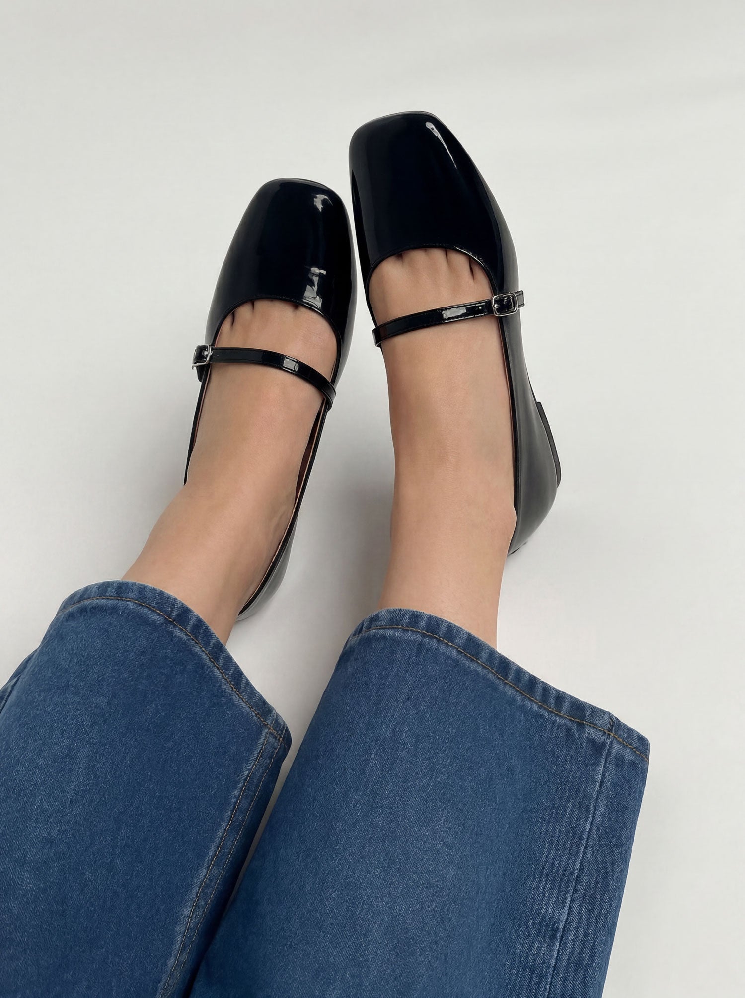 Glossy Black patent leather mary jane flats worn with jeans front view Pakistan — Laal Mahal