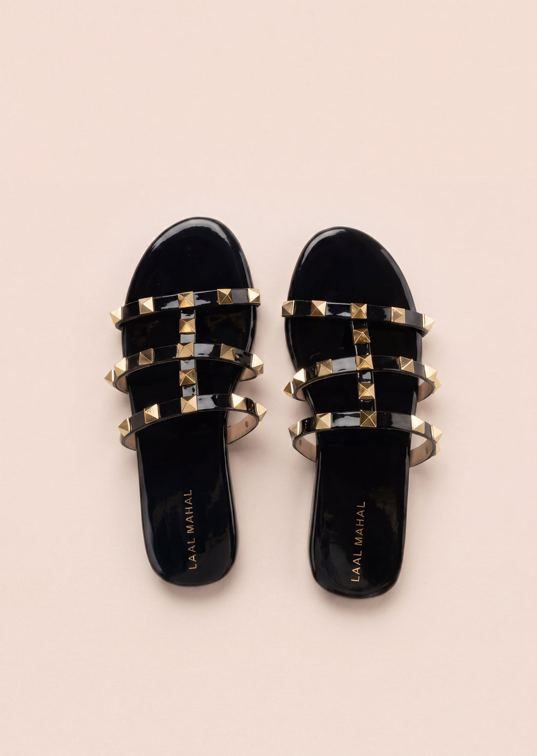 Laal Mahal Rockstud Flat Slide Sandals black top view showing branded insole and gold pyramid stud triple straps