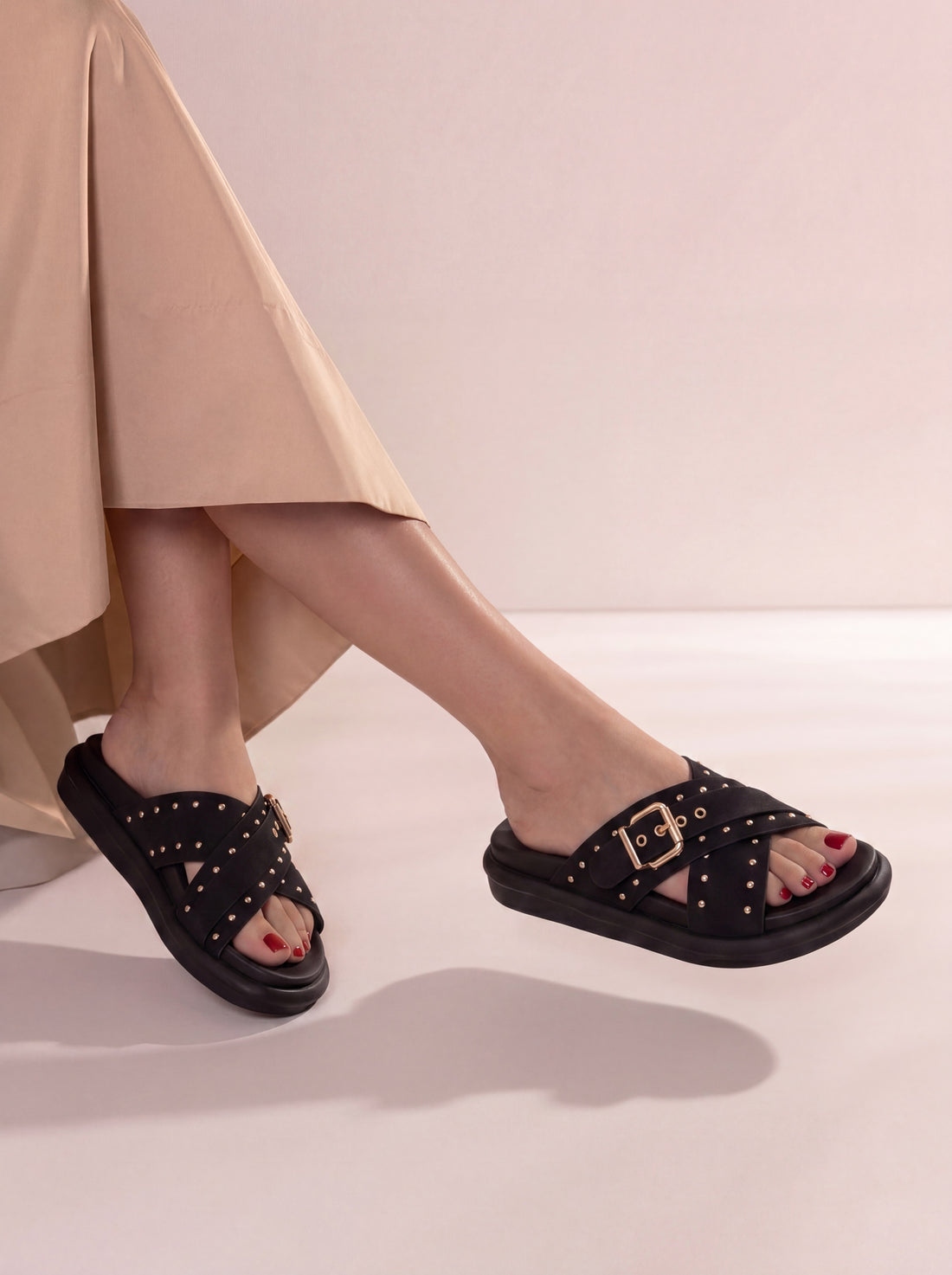Laal Mahal Vesper Studded Crossover Sandals black worn on foot with beige outfit – women's comfort sandals Pakistan