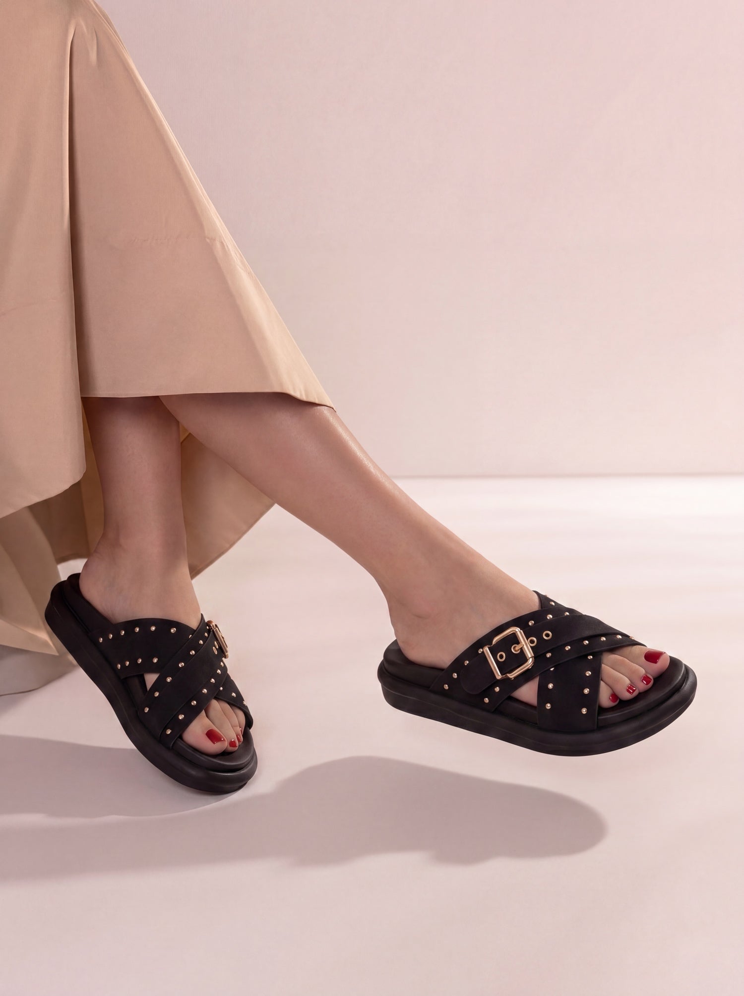 Laal Mahal Vesper Studded Crossover Sandals black worn on foot with beige outfit – women's comfort sandals Pakistan