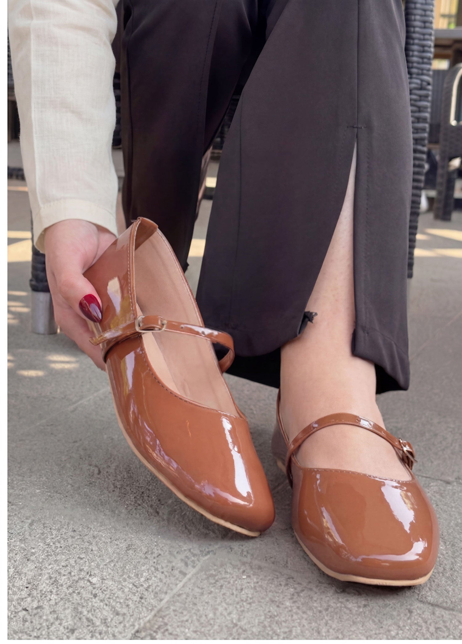 Mocha brown patent leather mary jane flat shoes worn close up Pakistan — Laal Mahal