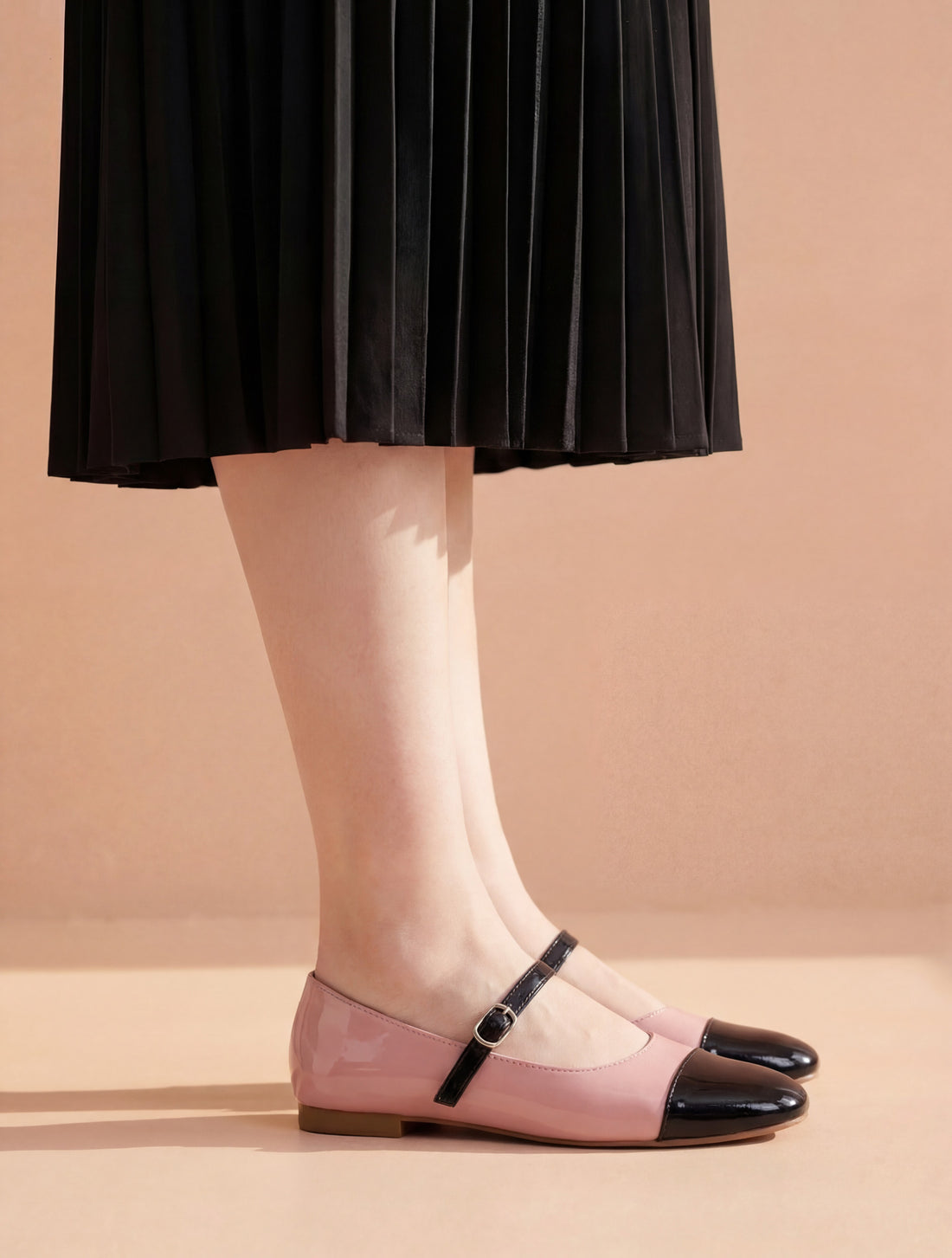 Pink and Black Two-Tone Mary Jane flat shoes worn with black skirt Pakistan — Laal Mahal
