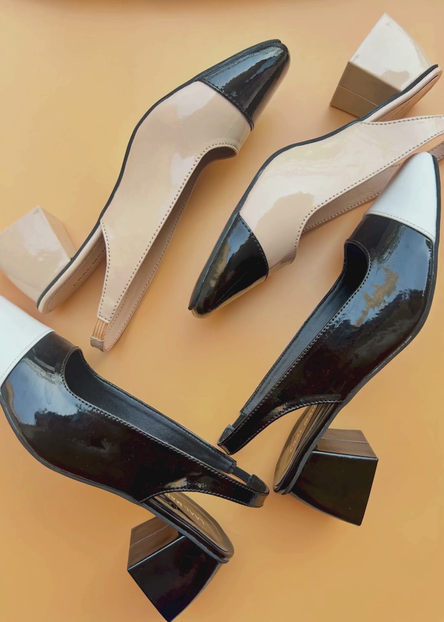 Black and white slingback block heels pair angled view Pakistan — Laal Mahal