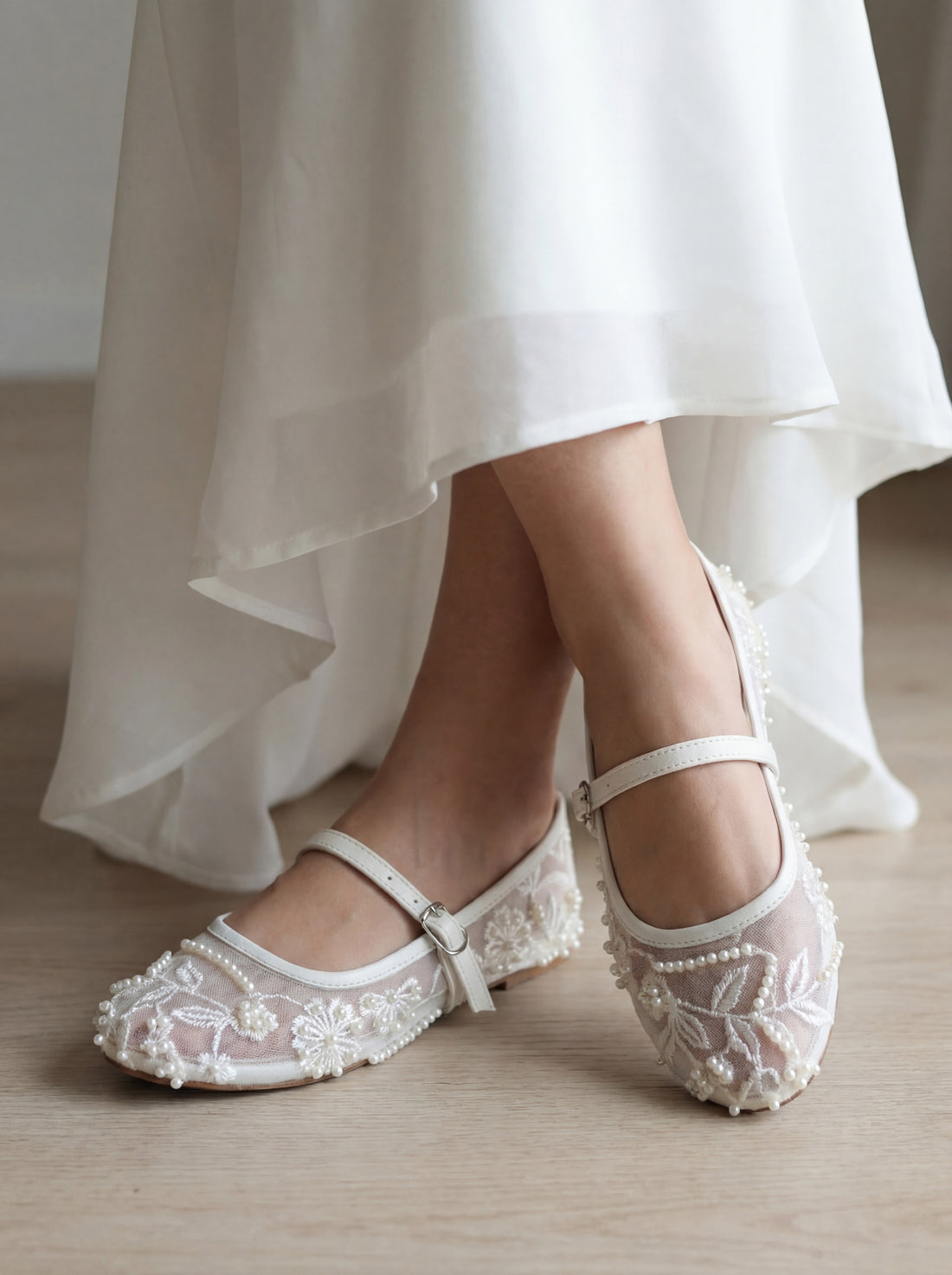 Woman wearing white embroidered mesh ballerina flat shoes with buckle strap – Laal Mahal Pakistan