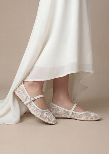 Woman wearing white embroidered mesh ballerina flat shoes with buckle strap – Laal Mahal Pakistan