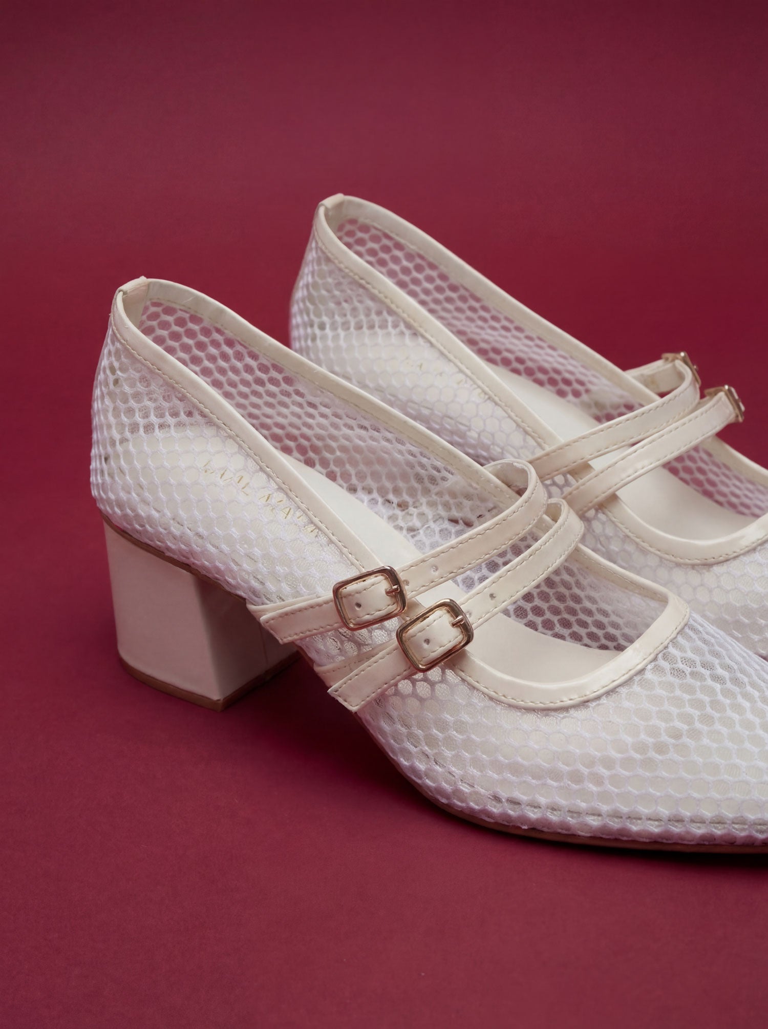 White mesh double buckle block heels worn front view red background Pakistan — Laal Mahal